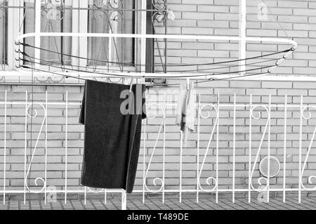 Hanging clothes on the clothes horse with pins (Pesaro, Italy) Stock Photo