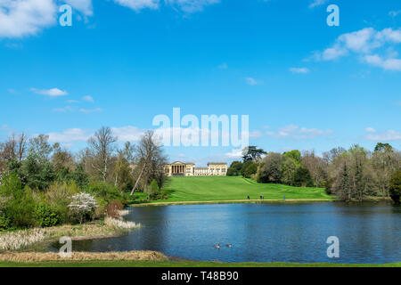 A view of Stowe House and gardens looking across the Octagon lake, Buckingham, Buckinghamshire, UK Stock Photo