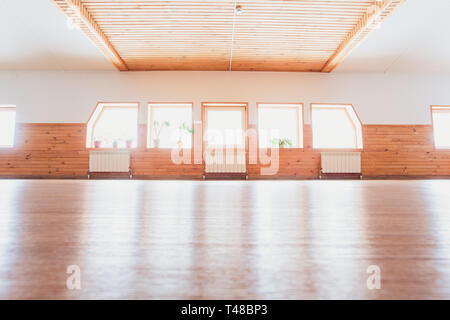 Empty Yoga Studio Interior With Windows And Unrolled Mat Stock