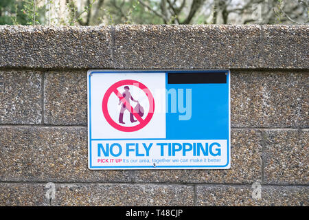 No fly tipping sign on wall Stock Photo