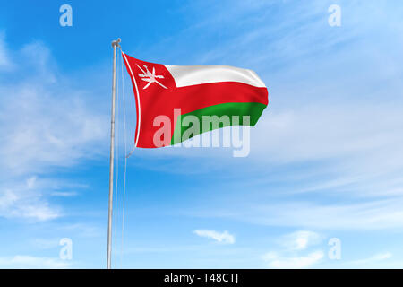 Oman flag blowing in the wind over nice blue sky background Stock Photo