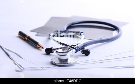stethoscope,x-ray and pen on the table. Stock Photo