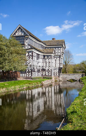 Little Moreton Hall, moated black and white half timbered Tudor manor house near Congleton in Cheshire, owned by the national trust Stock Photo