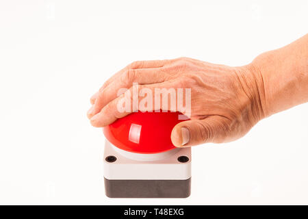 Hand pushing a red buzzer Stock Photo