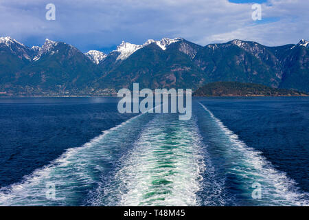 Wake in Howe Sound from behind a BC Ferry traveling from Horseshoe Bay to Langdale on the Sunshine Coast, British Columbia, Canada. Stock Photo