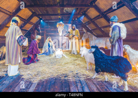 Bucharest, Romania - December 25, 2017: Christmas scene with three wise men presenting gifts to baby Jesus, Mary & Joseph Stock Photo