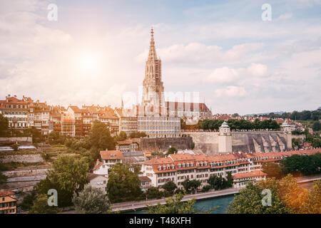 Panoramic view on Bern Minster and historic old town of Bern in Switzerland. Summer landscape, sunny day and blue sky Stock Photo