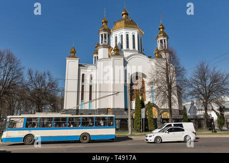 ROVNO, UKRAINE - APRIL 09, 2018: City traffic on the street in front of St. Pokrovsky Patriarch Cathedral. Rovno or Rivne is a historic city in wester Stock Photo