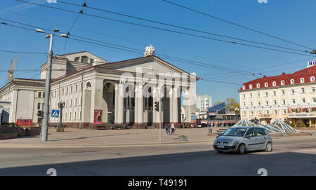 ROVNO, UKRAINE - APRIL 09, 2018: People walk in front of Academic Ukrainian Music and Drama Theater. Rovno or Rivne is a historic city in western Ukra Stock Photo