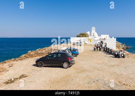 SIFNOS, GREECE - September 11, 2018: Parking at the Chrisopigi Monastery on south east coastline of Sifnos. Cyclades, Aegean Sea, Stock Photo