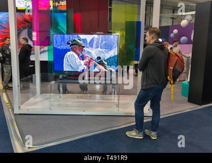 KYIV, UKRAINE - APRIL 06, 2019: People visit LG, a South Korean multinational conglomerate corporation booth during CEE 2019 in Tetra Pak EC. Stock Photo