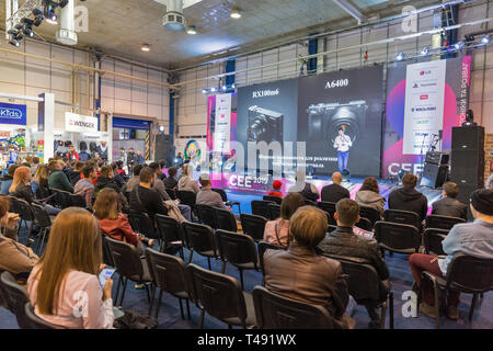 KYIV, UKRAINE - APRIL 06, 2019: People visit presentation of Sony professional photographic cameras during CEE 2019, the largest consumer electronics  Stock Photo