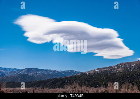 Unusual cloud formations against clear cobalt blue sky; Methodist Mountain; central Colorado, USA Stock Photo