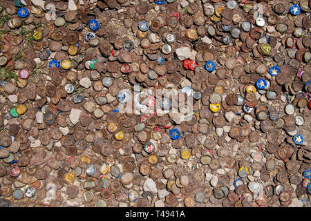 Beer bottles caps covering the backyard of a bar in Marfa, Texas. Stock Photo