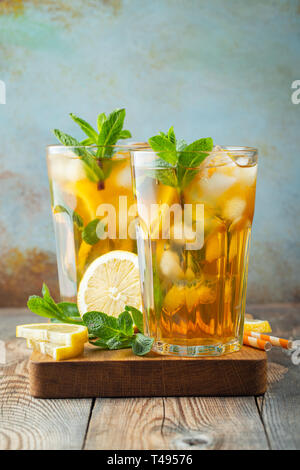 Iced tea with lemon and ice in tall glasses. Stock Photo