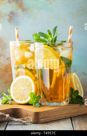 Iced tea with lemon and ice in tall glasses. Stock Photo