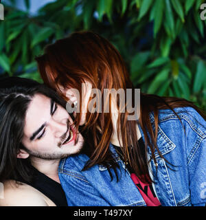 Happy couple in love, having fun and fooling around outdoors and smiling. Stock Photo