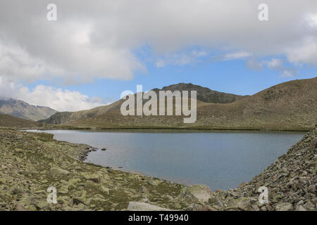 Panorama of lake scenes in mountains, national park Dombay, Caucasus, Russia, Europe. Dramatic blue sky and sunny landscape in summer day Stock Photo