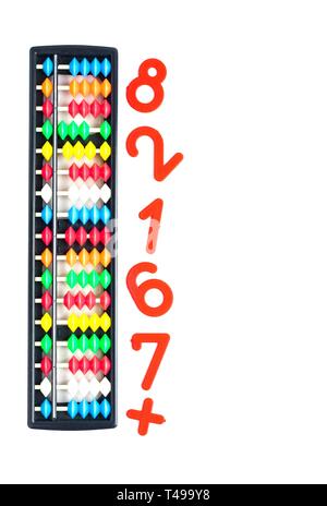 Japanese traditional calculator abacus and numbers on white Stock Photo