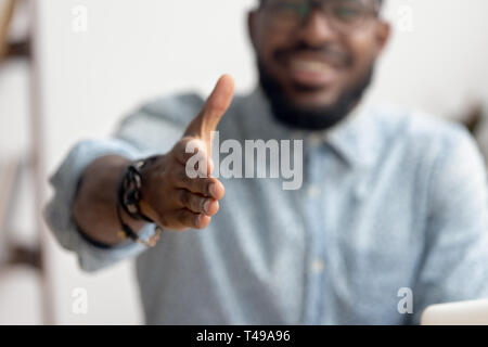 African professional businessman recruiter consultant extending hand at camera Stock Photo