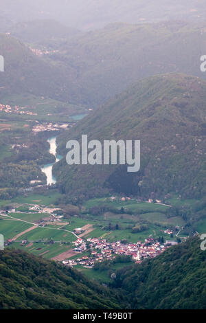 View from border road Slovenia, Italy to small village Volče in Soca valley in Triglav National Park in Julian Alps Stock Photo
