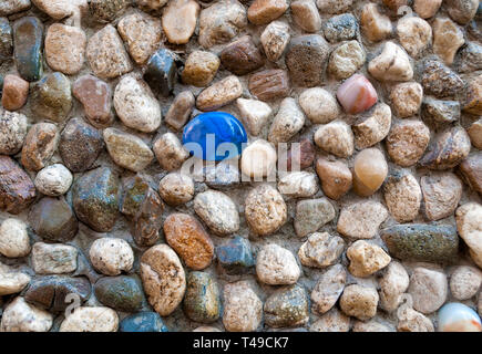 Colored pebbles as wall decorations; Stock Photo