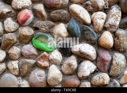 Colored pebbles as wall decorations; Stock Photo