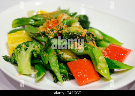 Stir fried graden vegetable with mincced garlic (Vegetable stir fry in a dish) Stock Photo