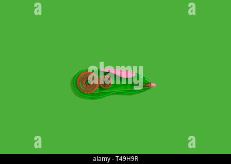 tape corrector on a green background Stock Photo