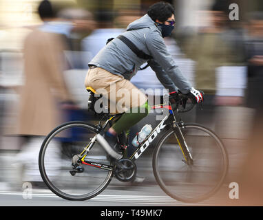 Tokyo, Japan. 6th Apr, 2019. A man rides his bike at Ginza in Tokyo Japan on Sunday, April 7, 2019. Photo: Ramiro Agustin Vargas Tabares Credit: Ramiro Agustin Vargas Tabares/ZUMA Wire/Alamy Live News Stock Photo