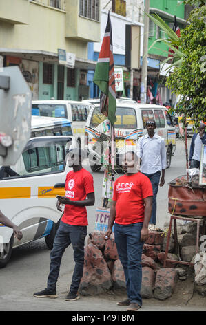 Activists allied to  Kenya’s Red Vests Movement are seen walking on the street of Nakuru during the anti-corruption protest Activists allied to Kenya’s Red Vests Movement were protesting silently about increased levels of corruption in the government, the activists are demanding action to be taken against all government officials involved in corruption. Kenya loses billions of dollars to corruption in government departments every year and very less action is taken to curb the vice. Every Sunday the activists conduct an anti-corruption protest in churches and streets in different towns of Kenya Stock Photo