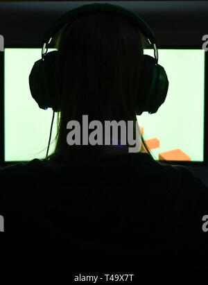 Berlin, Germany. 12th Apr, 2019. A visitor plays a computer game at the Gamefest in the Kulturbrauerei as part of Gamesweekberlin 2019. The international network meeting of the games industry will take place from 08.04. to 14.04.2019. Credit: Jens Kalaene/dpa-Zentralbild/dpa/Alamy Live News Stock Photo