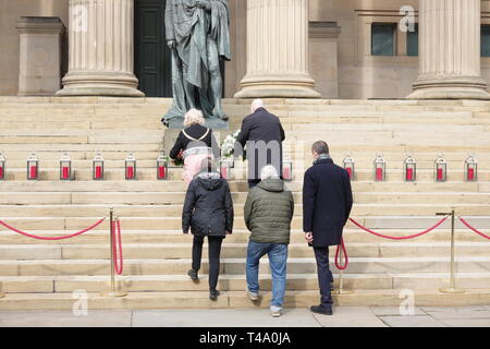 Liverpool, UK. 15th Apr, 2019. Mayor Joe Anderson and Lord Mayor Councillor Christine Banks lay a wreath at the memorial service at St George's Hall to mark the 30th anniversary of the Hillsborough disaster in which 96 Liverpool supporters lost their lives. Credit: ken biggs/Alamy Live News Stock Photo