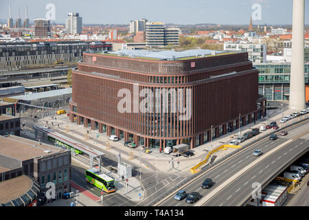Hannover, Germany. 11th Apr, 2019. A new building of the Deutsche Bahn DB can be seen in front of the city silhouette. Credit: Moritz Frankenberg/dpa/Alamy Live News Stock Photo