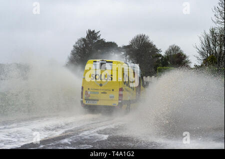 Skibbereen, West Cork, Ireland. 15th Apr, 2019. Much of Ireland is currently in the midst of a Status Orange Rainfall Warning, issued by Met Éireann. A van races through a spot flood on the N71 near Skibbereen. Credit: Andy Gibson/Alamy Live News Stock Photo