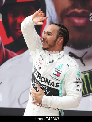 Shanghai, China. 14th Apr, 2019. Mercedes driver Lewis Hamilton of Britain celebrates after the Formula One Chinese Grand Prix in Shanghai, China, on April 14, 2019. Credit: Ding Ting/Xinhua/Alamy Live News Stock Photo