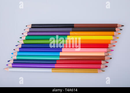 Set of double colored pencils on white background. Colored pencil, two sided. Stock Photo