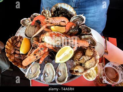 large platter of seafood oysters crab shrimp Stock Photo