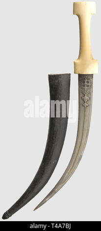 A Caucasian silver-mounted kinjal, circa 1900. Double-edged blade (somewhat notched) with double fullers on each side. Gilded silver grip with fine engraving and niello on the obverse side. A crown (Egyptian) and an Arabic inscription engraved on the back of the pommel. Wooden scabbard with its mountings gilded and nielloed en suite, and a short leather insert on the back. Pommel slightly defective. Fine craftsmanship. Length 50 cm, historic, historical, 1900s, 20th century, 19th century, Persian Empire, object, objects, stills, clipping, clippin, Additional-Rights-Clearance-Info-Not-Available Stock Photo