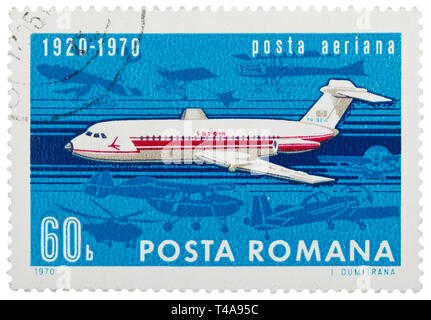 ROMANIA - CIRCA 1970: Stamp printed in Romania shows image of the flying jet plane, symbol of air mail, circa 1970 Stock Photo
