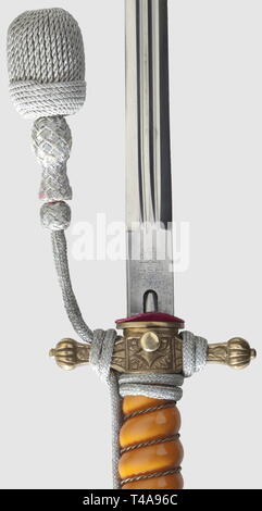 A model 1938 dagger for naval officers, with portepee and hanger, Maker Alcoso, Solingen Undecorated blade with etched maker's mark on the ricasso. Pommel and crossguard with mostly intact gilding. Orange-coloured plastic grip. Push-button scabbard release. Gilt 'lightning bolt' scabbard. Length 38.5 cm. Silver portepee. Black ribbed silk hanger with black velvet liner and silvered fittings for an administrative official, maker's label 'W. Gossmann', historic, historical, 1930s, 20th century, navy, naval forces, military, militaria, branch of service, branches of service, a, Editorial-Use-Only Stock Photo