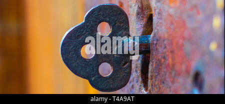 A really old Key in Door Stock Photo