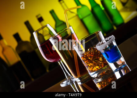 Different alcohol drinks and cocktails on bar Stock Photo