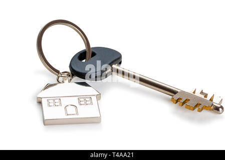 key with a key fob in the form of a house on a white background is isolated Stock Photo