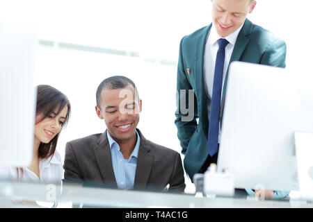 project Manager and business team discussing work documents Stock Photo