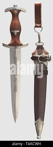 A model 1933 SA service dagger, with dedication and vertical leather hanger, Maker ROMÜSO, Solingen The blade in beautiful condition with etched motto and maker's logo, the reverse with etched dedication 'In treuer Kameradschaft. Josef Einöder - Sturmbannführer'. Nickel silver grip fittings, the crossguard punched 'Ho' for SA Group Hochland. Brown wooden grip with inset nickel silver eagle and enamelled SA emblem. Burnished steel scabbard (minimal scratches) with nickel silver fittings. Vertical hanger of brown leather. Length 35 cm. An outstandingly well-preserved dagger. , Editorial-Use-Only Stock Photo