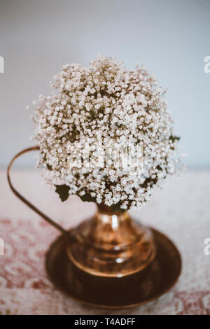 bridal bouquet in an antique jug Stock Photo