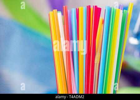 Straws of different bright colors collected in a pile Stock Photo