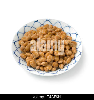 Bowl with traditional Japanese fermented soybeans called natto isolated on white background Stock Photo