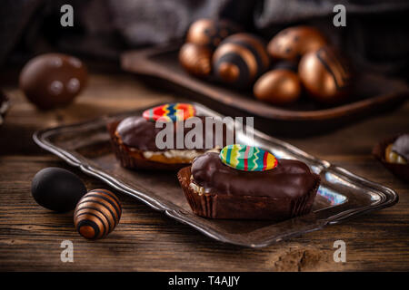 Sweet fancy cakes with cream inside on the tray Stock Photo